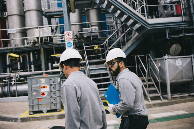 two veolia employees on site